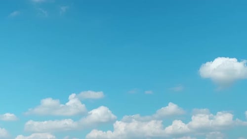 Blue Sky with Fluffy White Clouds