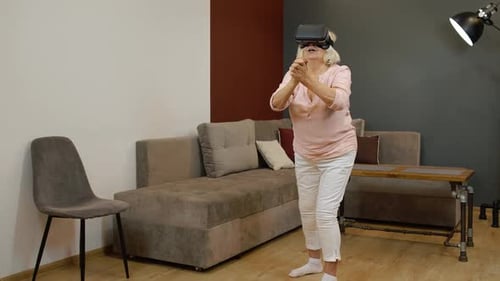 Senior Woman Enjoying Virtual Reality at Home