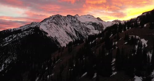 Sunset in the Rocky Mountains in Colorado along the Million Dollar Highway with drone videoing up.