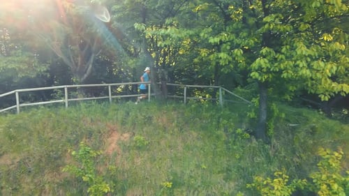 Male Athlete Running in the Park