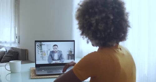 Woman Having a Virtual Meeting on Laptop