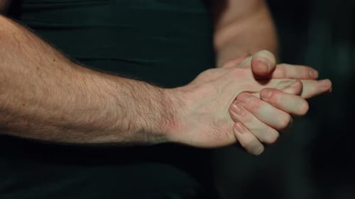 Adult Man Rubbing Hands Together, Close Up