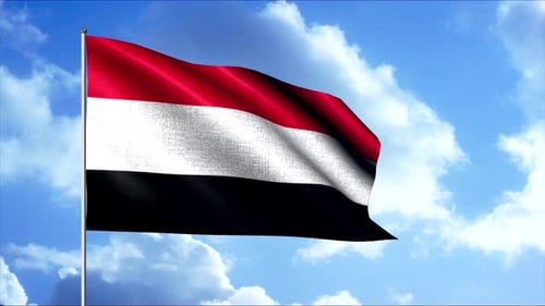 National Flag of Yemen Waving Against a Clear Blue Sky
