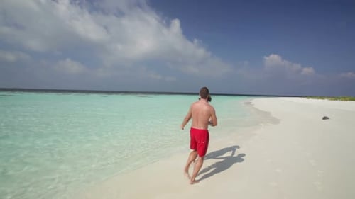 Young Couple Having Fun on Deserted Island