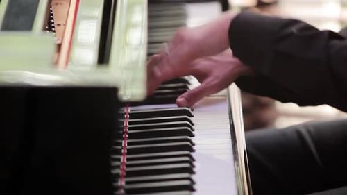 Man Playing Piano Keys, Close Up View