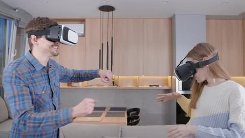 Couple Enjoys Virtual Reality in Living Room