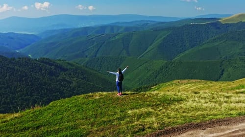 Traveler Raising Hands Looking in Nature Scene