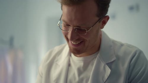 Portrait Smiling Doctor Consulting in Hospital Office