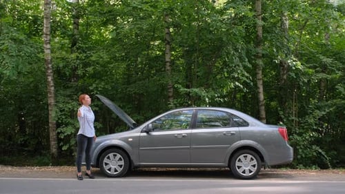 Woman Trying To Stop the Car on the Road.