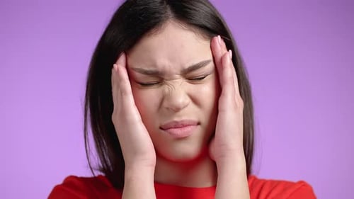 Young Woman Having Headache Studio Portrait