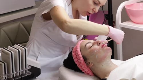 Woman Receives Facial Treatment at a Beauty Spa