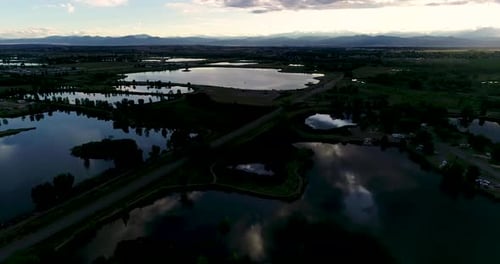 Glorious mountain sunset with reflections in lakes and ponds. Shot by drone from 185ft 4k 60fps