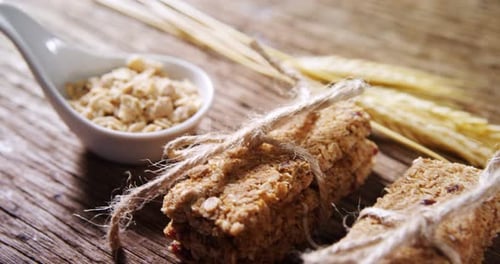 Rustic Granola Bars Oats and Wheat on Wood