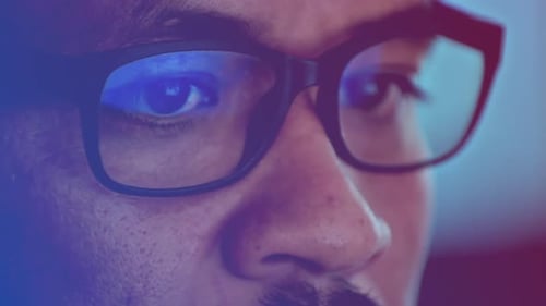 Men wearing glasses while working in the office,