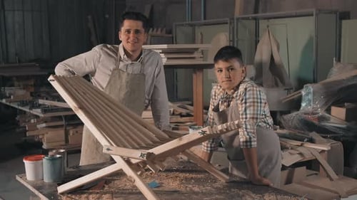 Father And Son With DIY Chair