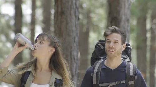Young couple hiking in woods