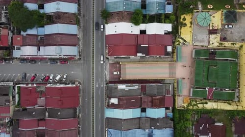 Aerial descending down Chinese temple and car traffic