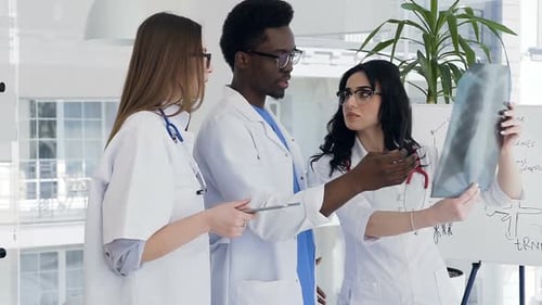 Group of Doctors Discuss x-ray in the Modern Clinic