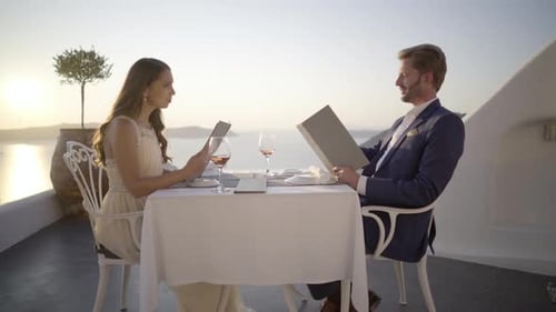 Rich Couple at Romantic Dinner Outdoors in Greece