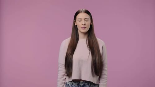Brunette Woman Celebrates with Fist Pumping Gestures