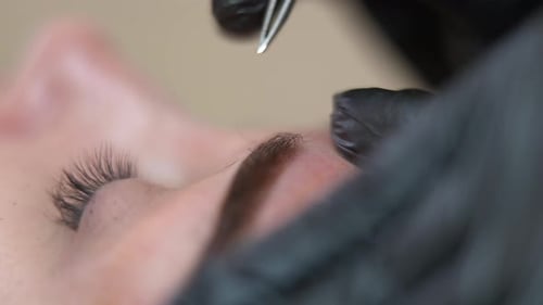 Eyebrow Shaping With Tweezers Close Up