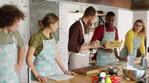 Cooking Class With Chef And Class Attendees Tasting