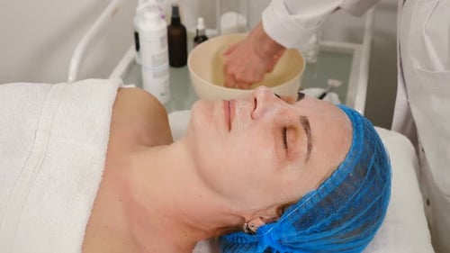 Woman Receives Facial Treatment at Beauty Spa