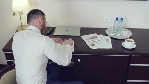 Businessman Working in Hotel on Business Trip