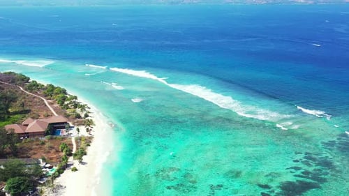 Ocean Waves in Maldives, tropical island on the sunny day, aerial panorama with copy space