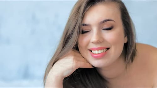 Fashion Model with Professional Beauty Makeup Posing in Studio