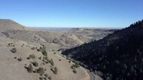 Aerial View of Mountain Road Under Clear Sky