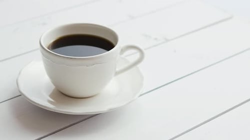Cup of Coffee on White Wooden Table