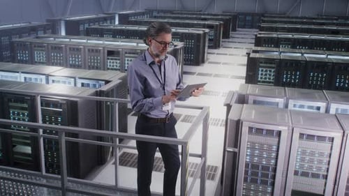 Mature Man Using Tablet in Data Center