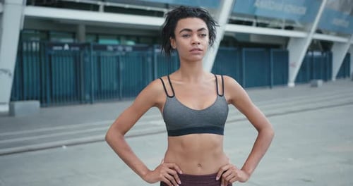 AfricanAmerican Mixed Race Sports Woman Standing in City