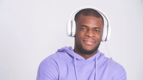Studio Portrait of Handsome Young Man of African Eternity and Headphones