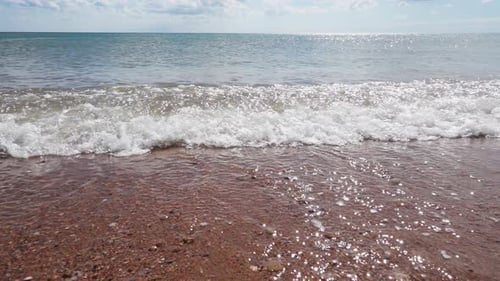 Sea surf on sandy beach, slow motion 250 fps