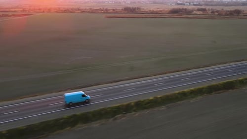 Aerial View of Cargo Van Driving on Highway Hauling Goods