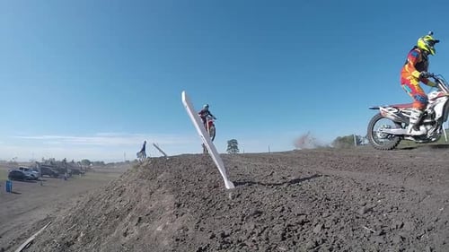 Dirt Bikes Jumping on Rural Motocross Track