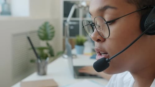 Closeup of Female Face Call Center Worker Talking to Client with Headset Microphone