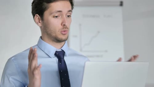 Close Up of Online Video Chat by Young Businessman