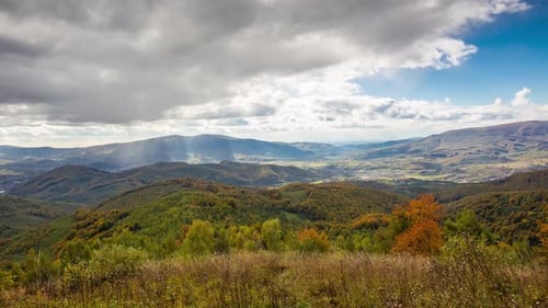 Beautiful time-lapse in the autumn mountains. Sun rays in the mountains