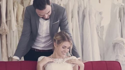 Happy Couple Shopping for Wedding Dress Together