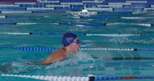 Swimmers swimming into the pool