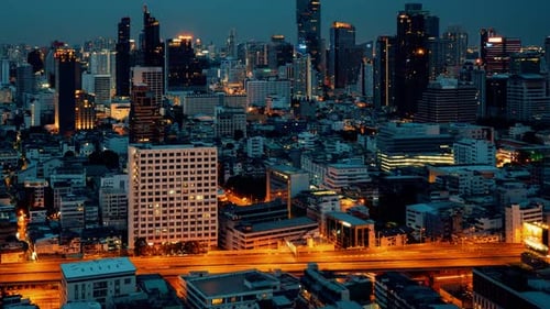 Time Lapse Night Cityscape and Highrise Buildings in Metropolis City Center