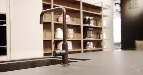Modern Kitchen with Sleek Dark Faucet