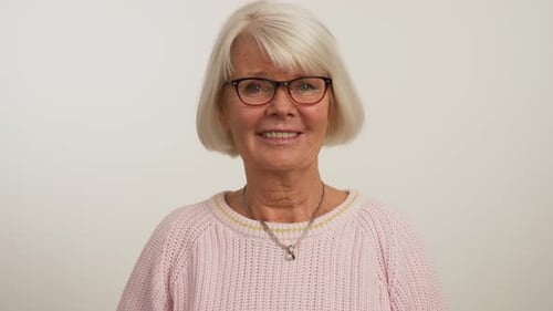 Smiling Senior Woman Portrait with White Hair and Glasses