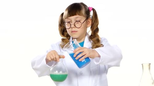 Girl Mixing Colorful Liquids in Science Experiment