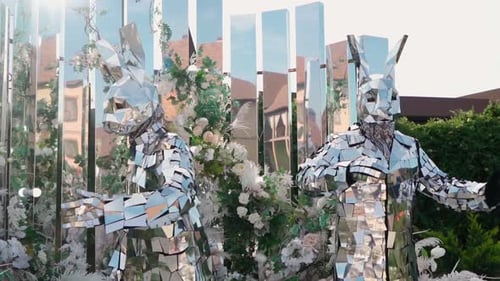 Shimmering Mirror Rabbit Figures in Outdoor Event