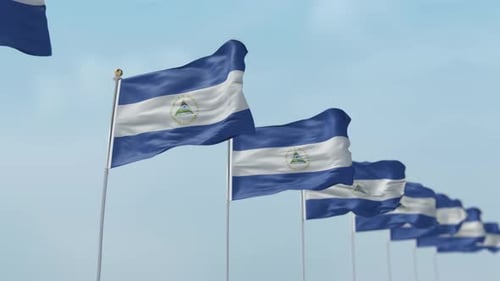 Nicaragua Flags Waving In Blue Sky