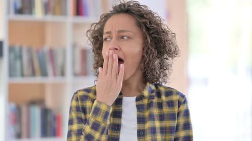 Portrait of Sleepy Mixed Race Woman Yawning